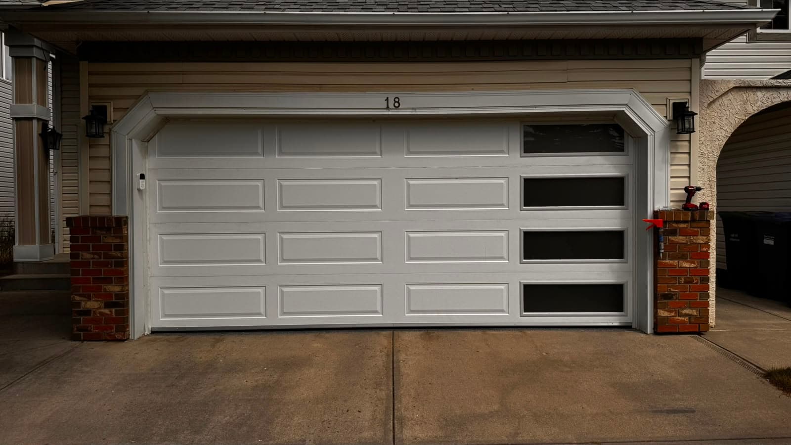 New garage door installed after replacement